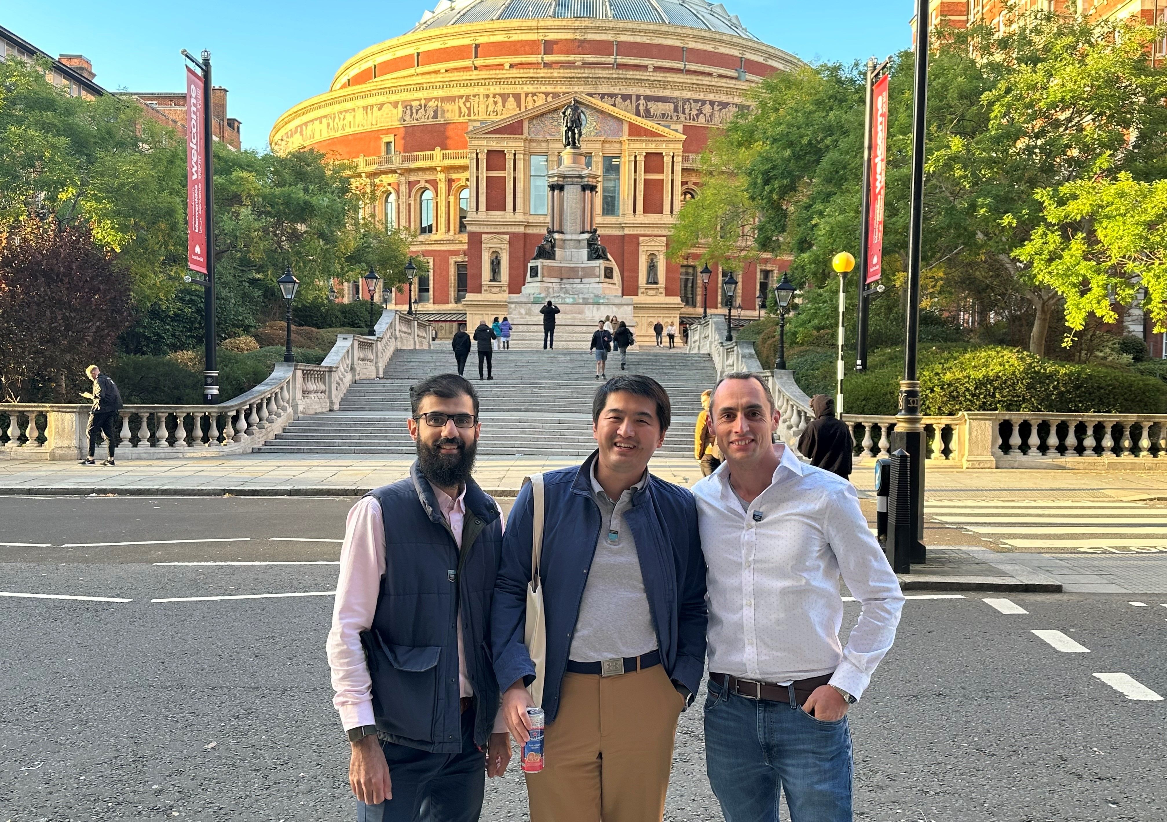 Three alumni from MSc Petroleum Engineering 2014 standing across the road from the Royal Albert Hall